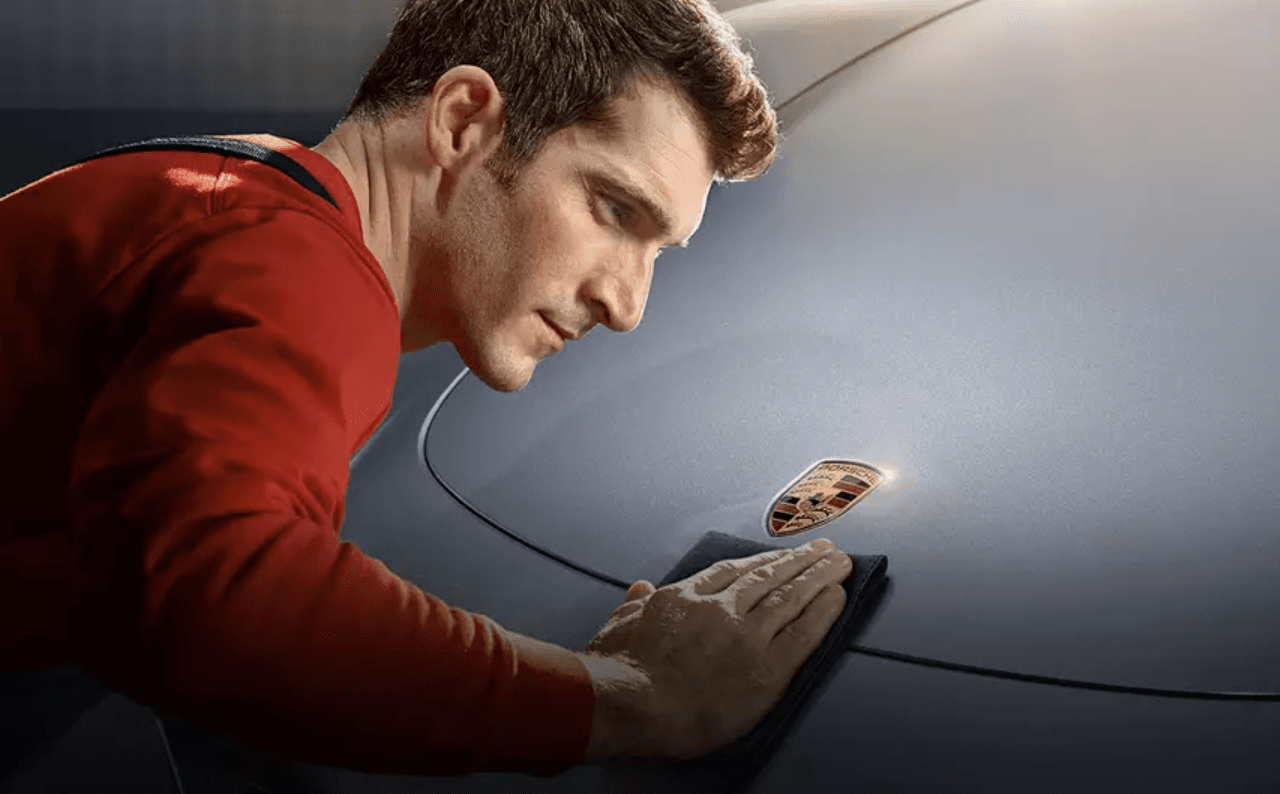 Porsche Service Technician Cleaning Vehicle - Feature Image
