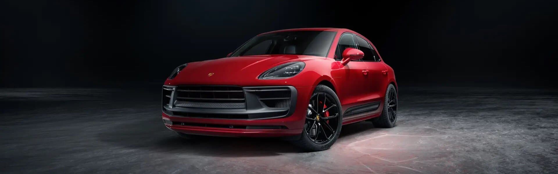 2024 Porsche Macan Parked In A Showroom Banner